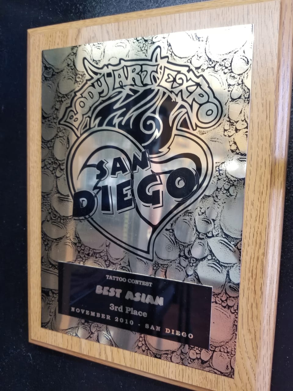 A framed Body Art Expo plaque reads "Best Asian" and "Third Place."
