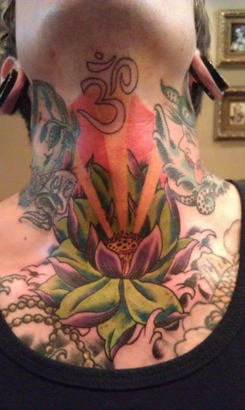 A color illustrative lotus with radiating orange rays and an Om symbol spans the chest and throat.